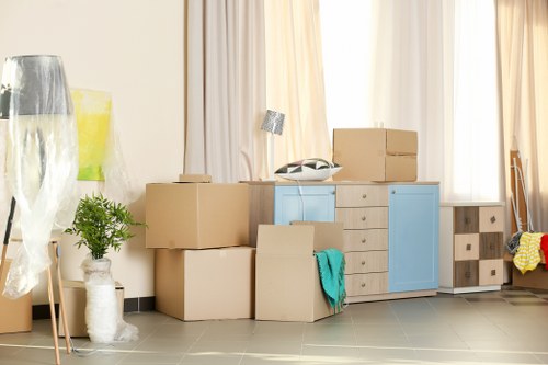 Office relocation planning in West Brompton with packed moving boxes and office furniture