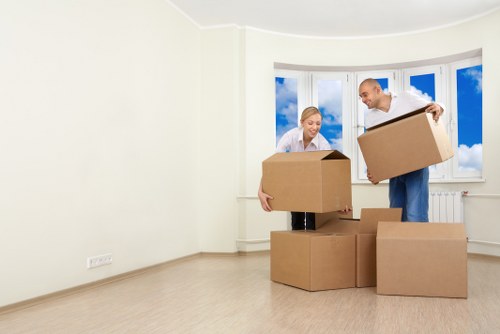 Professional movers loading office desks and boxes in West Brompton