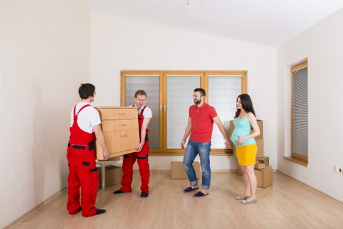 Local movers loading furniture for a residential relocation