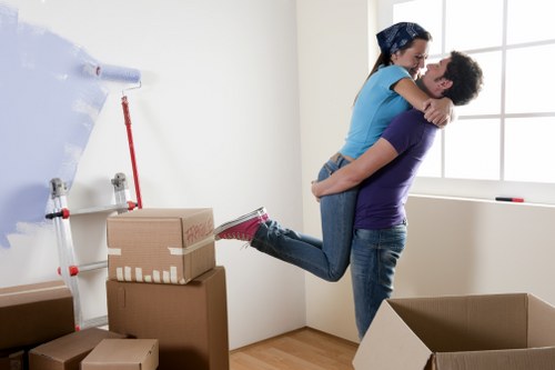Careful packing of fragile household items in a West Brompton property