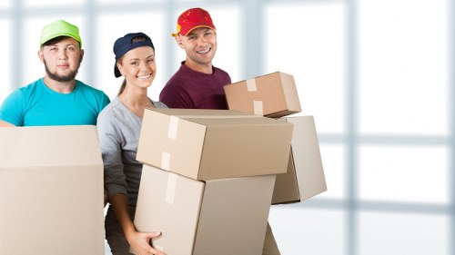Unpacking and organising boxes in a West Brompton flat