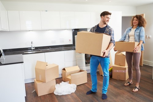 Packed household boxes and furniture ready for loading
