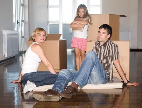 Packed boxes and furniture ready for removal in a West Brompton home